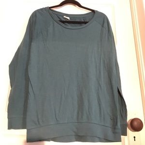 Lightweight, oversized, teal colored top
