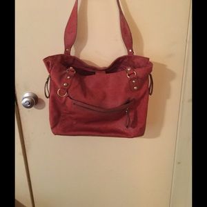 Bag it is a red/brown similar to Cordovan