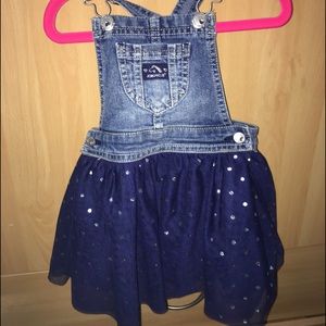 Navy blue denim skirt overall.