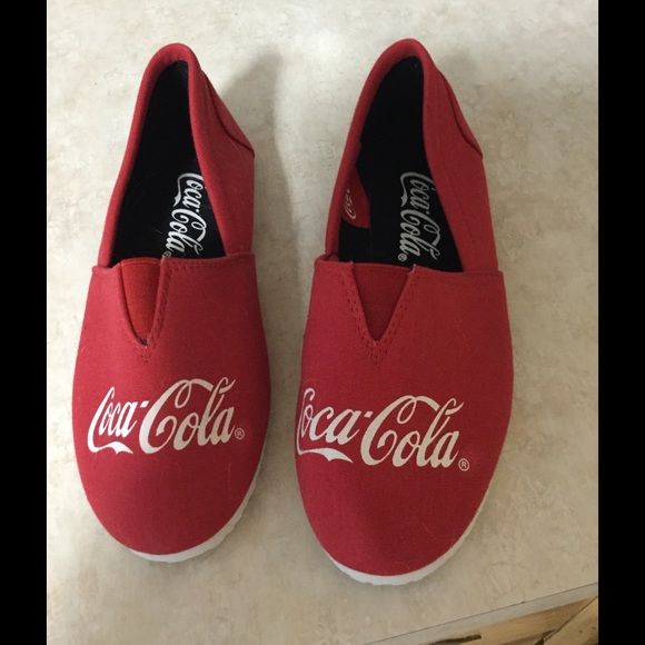 Red Coca-Cola slip-ons.  Size 7