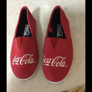 Red Coca-Cola slip-ons.  Size 7