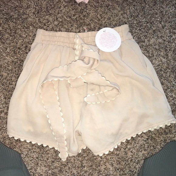 High Waisted cream shorts with tie belt size small