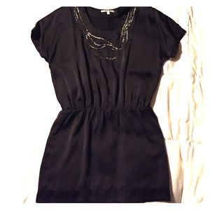 Little black dress with embellishment at neck