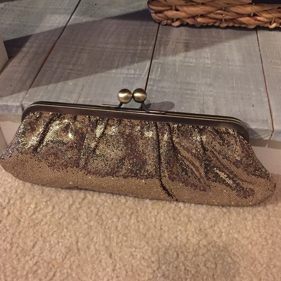 Gold sequin clutch bag