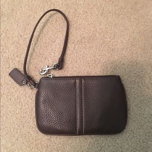 Brown leather coach wristlet