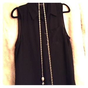 Black sheer sleeveless button down.