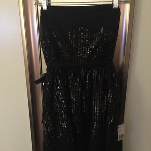 Black sparkly dress. Never been worn.