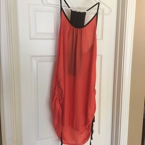 Super cute coral and black embellished top.