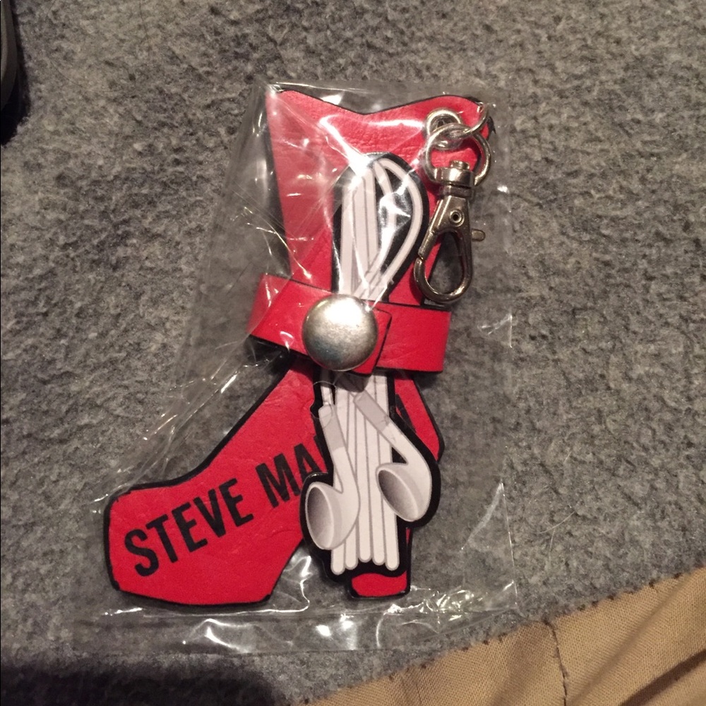 Ear Bud Holder by Steve Madden.  Red or black.