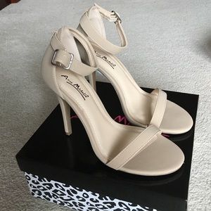 Never used nude simple strap high heel sandals.