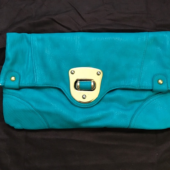 South moon under turquoise clutch