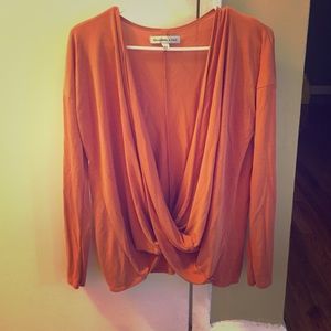 Rust orange wrap front blouse