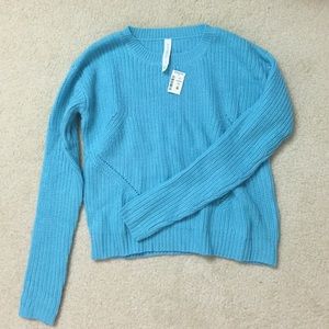 Blue sweater.