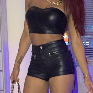 Leather top & shorts.