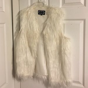 White fur vest