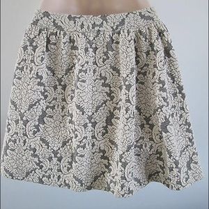 Ivory and black textured skater skirt