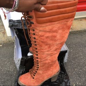 Knee high laces up boots