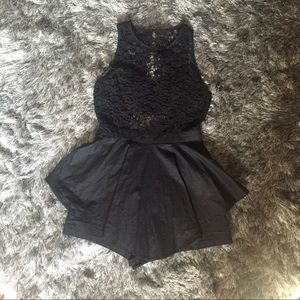 Black romper with skirt over lay
