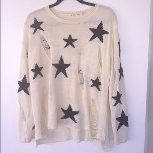 Black and ivory distressed sweater.
