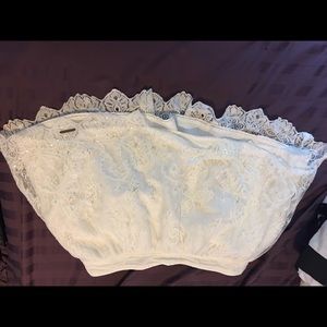 White lace and sequined mini skirt