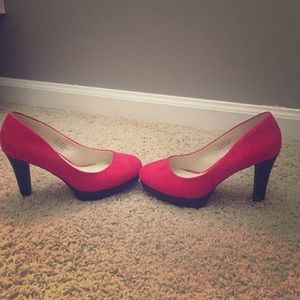 Red high heels with black bottom