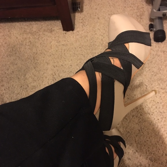Gray and black strapped heel