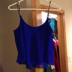 Blue tank top with black and gold chain straps
