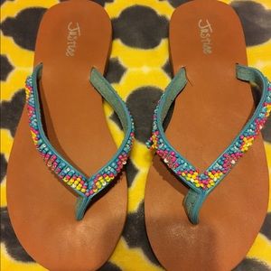 Adorable Justice Flip Flops in size 8M