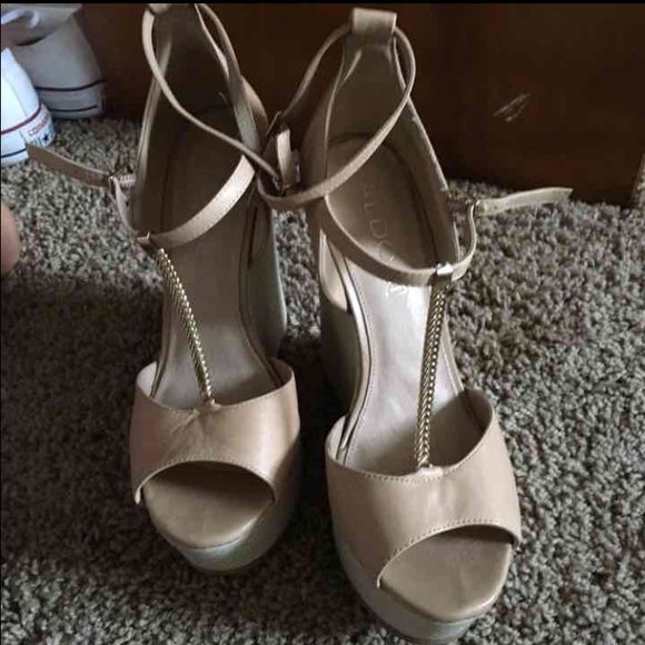 Tan pair of wedge shoes from Aldo size 9