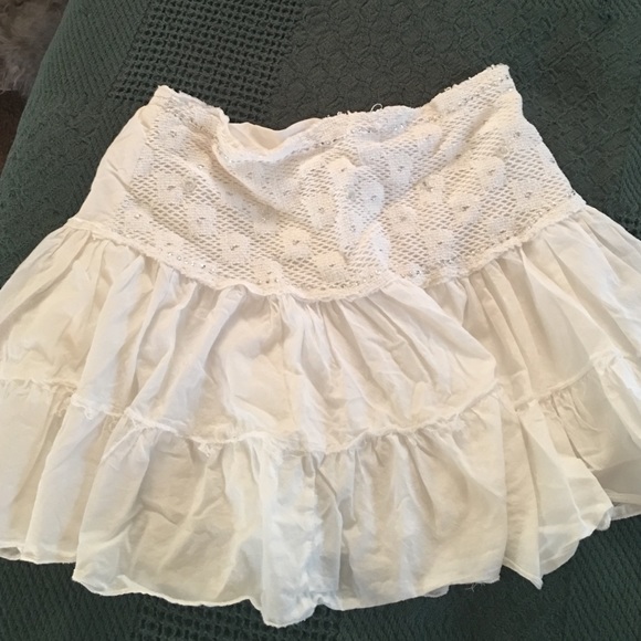 White mini with flower and sequence detailing