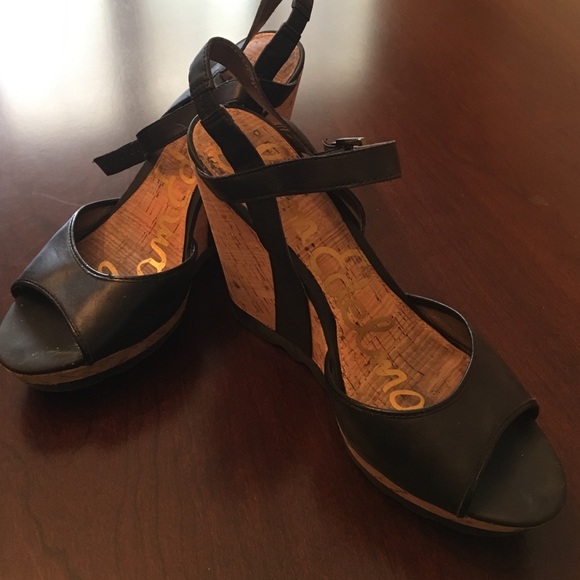 Platform cork wedge supports black strappy sandals
