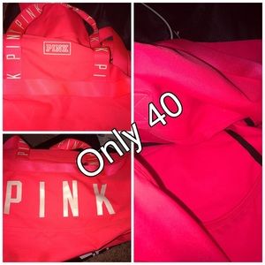 A pink Victoria's Secret duffel bag
