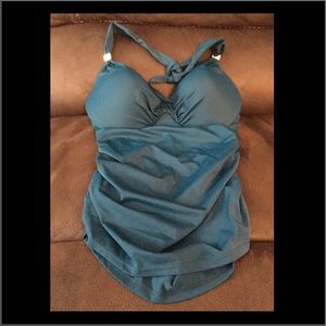 Never used Tankini top and has gold embellishments