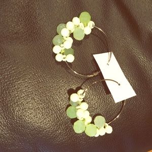 Green pierced earrings.