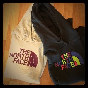 Two north face sweatshirts.