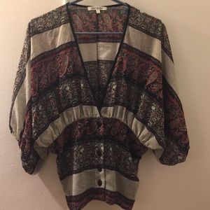 Semi-sheer blouse. Size S. Adjustable in the back.