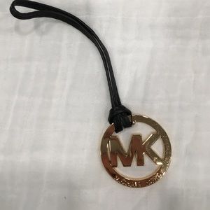 Michael Kors gold and black medallion