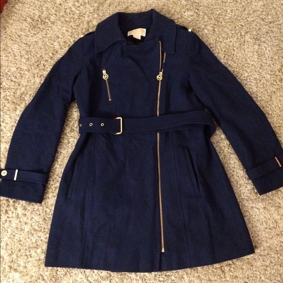 Royal blue jacket with gold zippers.