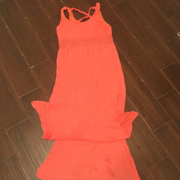 Pink dress with slits on both sides.