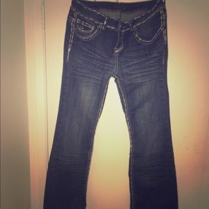 Long dark wash buckle jeans