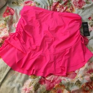 Pink skirted swimsuit bottom.