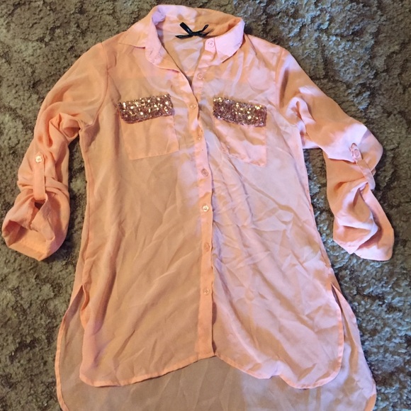Peach color button up. With sequence top pockets