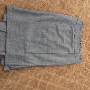 Grey fitted skirt, with bottom ruffles in back