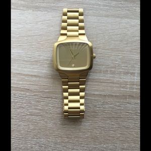 Nixon the big player gold watch.
