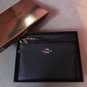 Coach Embossed small- L Zip wristlet in leather