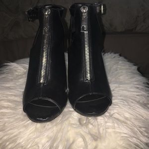 Aldo size 10 black leather zip booties.