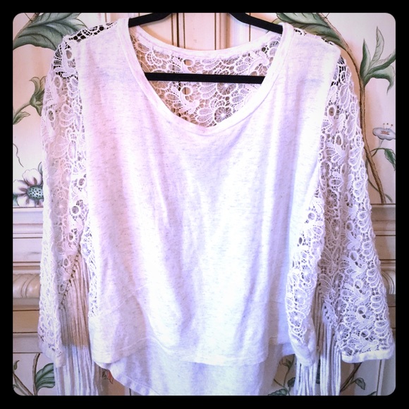 Embroidered sweater with fringe
