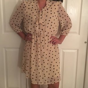Beige and black polka dot dress.