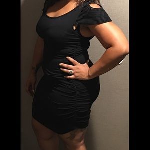 Fitted black dress with strappy sleeves