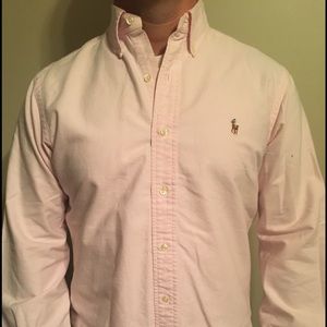 Long sleeved light pink button up polo.